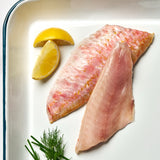 A portion of Red Mullet fillets from Rockfish Online Seafood Market on a baking tray