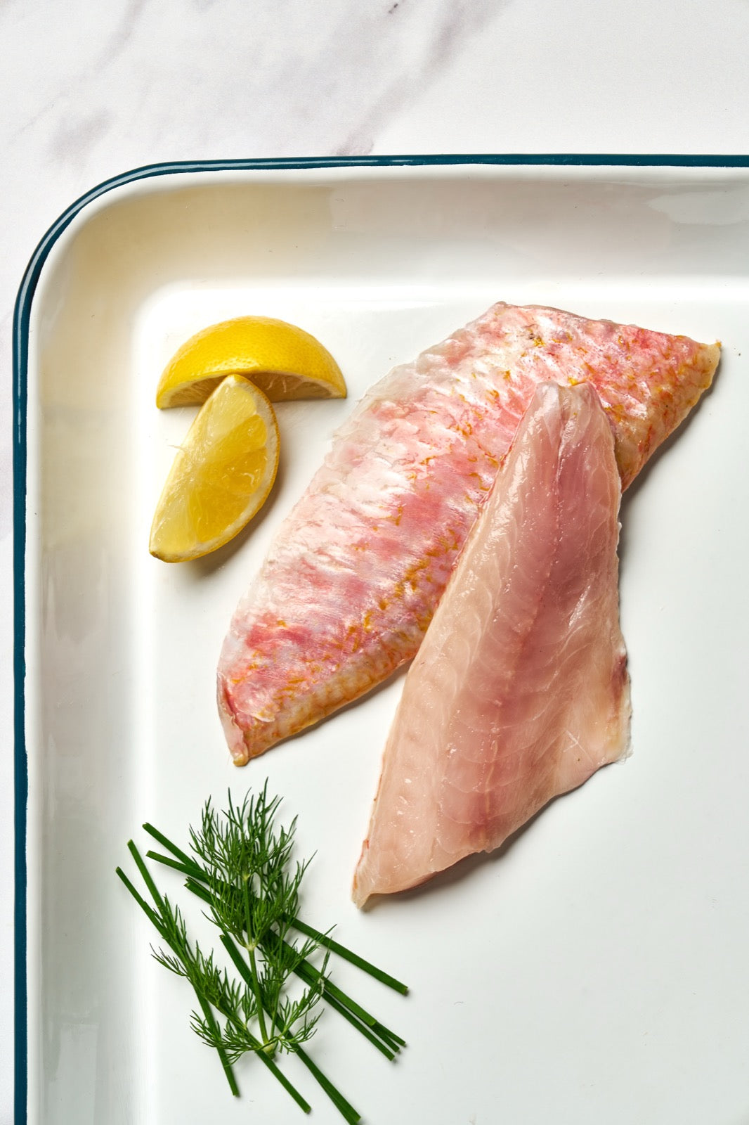 A portion of Red Mullet fillets from Rockfish Online Seafood Market on a baking tray