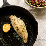 A portion of Gurnard fillet from Rockfish Online Seafood Market cooked in a cast iron skillet skin side down