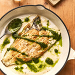 A portion of Plaice from Rockfish Online Seafood Market cooked in a pan drizzled in a salsa verde