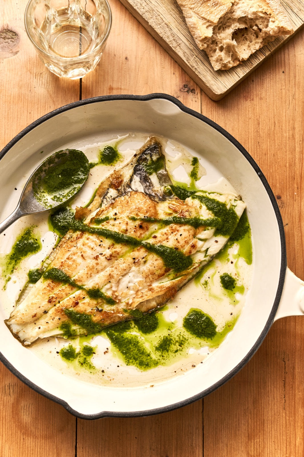 A portion of Plaice from Rockfish Online Seafood Market cooked in a pan drizzled in a salsa verde