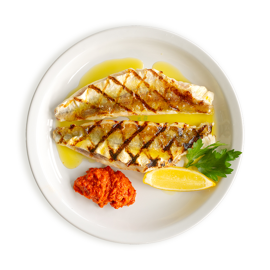 Grilled gurnard fillets dressed with a lemon oil and served with Romesco sauce and a wedge of lemon. Available in all Rockfish restaurants