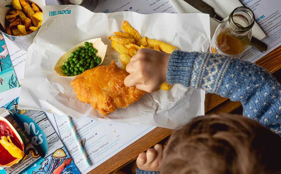 Child enjoying a Rockfish children's fish & chips