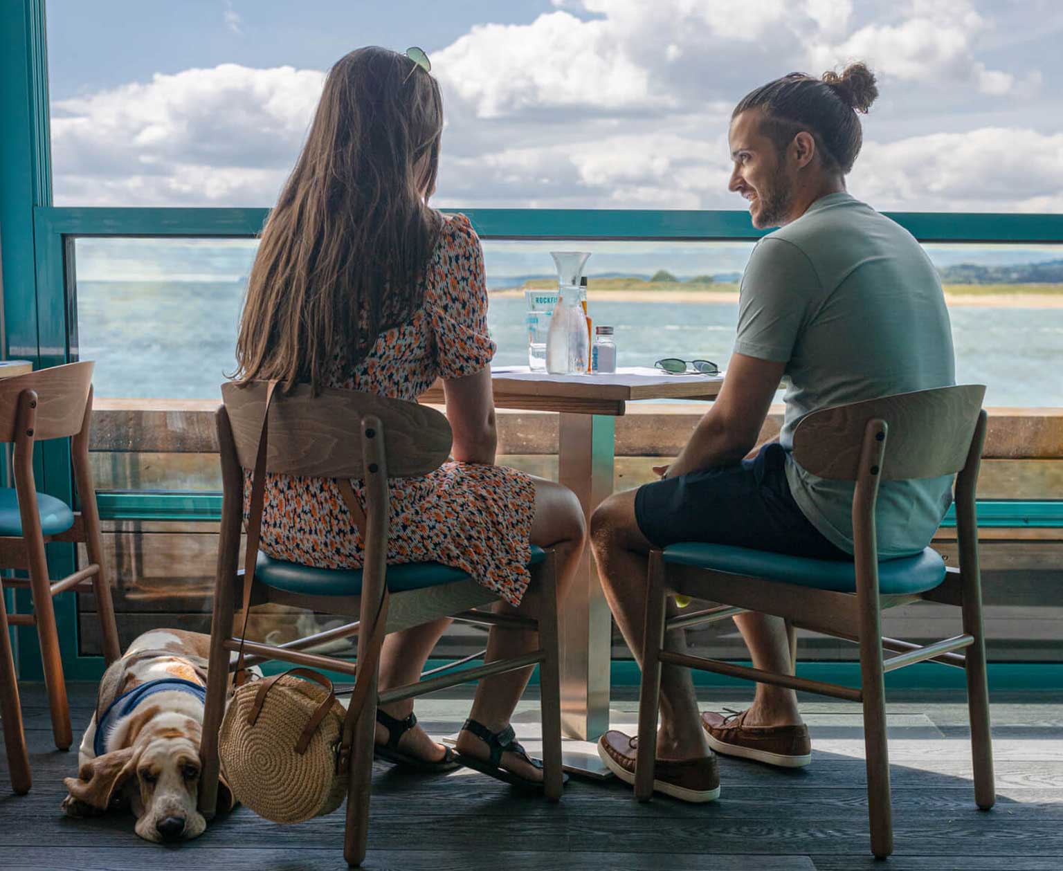 Couple with dog enjoying rockfish