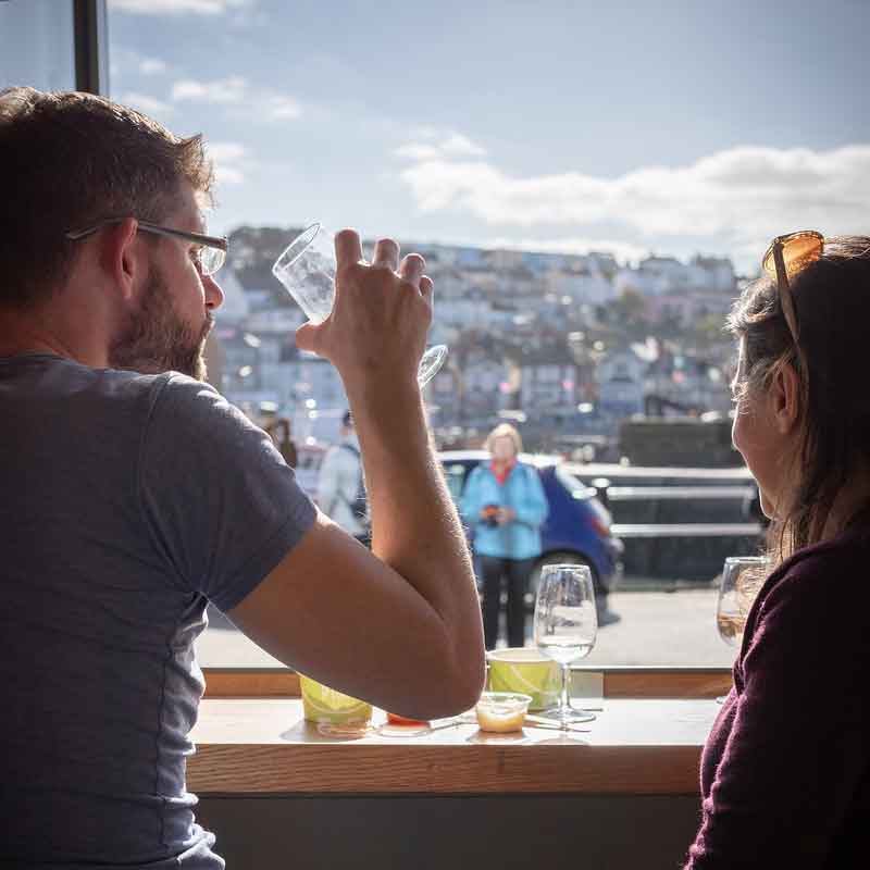 Two people enjoying a meal at Rockfish Brixham takeaway