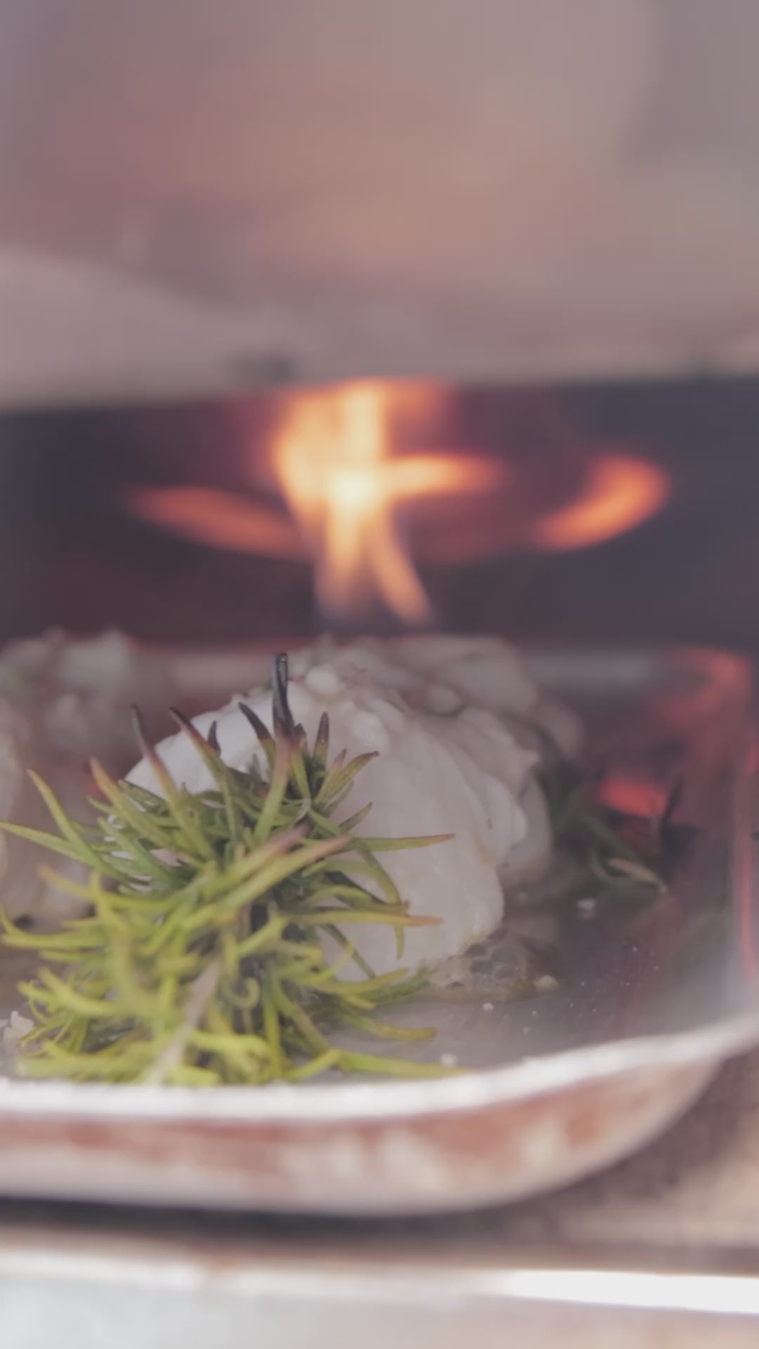 Mitch Tonks cooks Monkfish skewers on the quayside in Brixham in a pizza oven. The monkfish is skewered using natural rosemary stalks. 