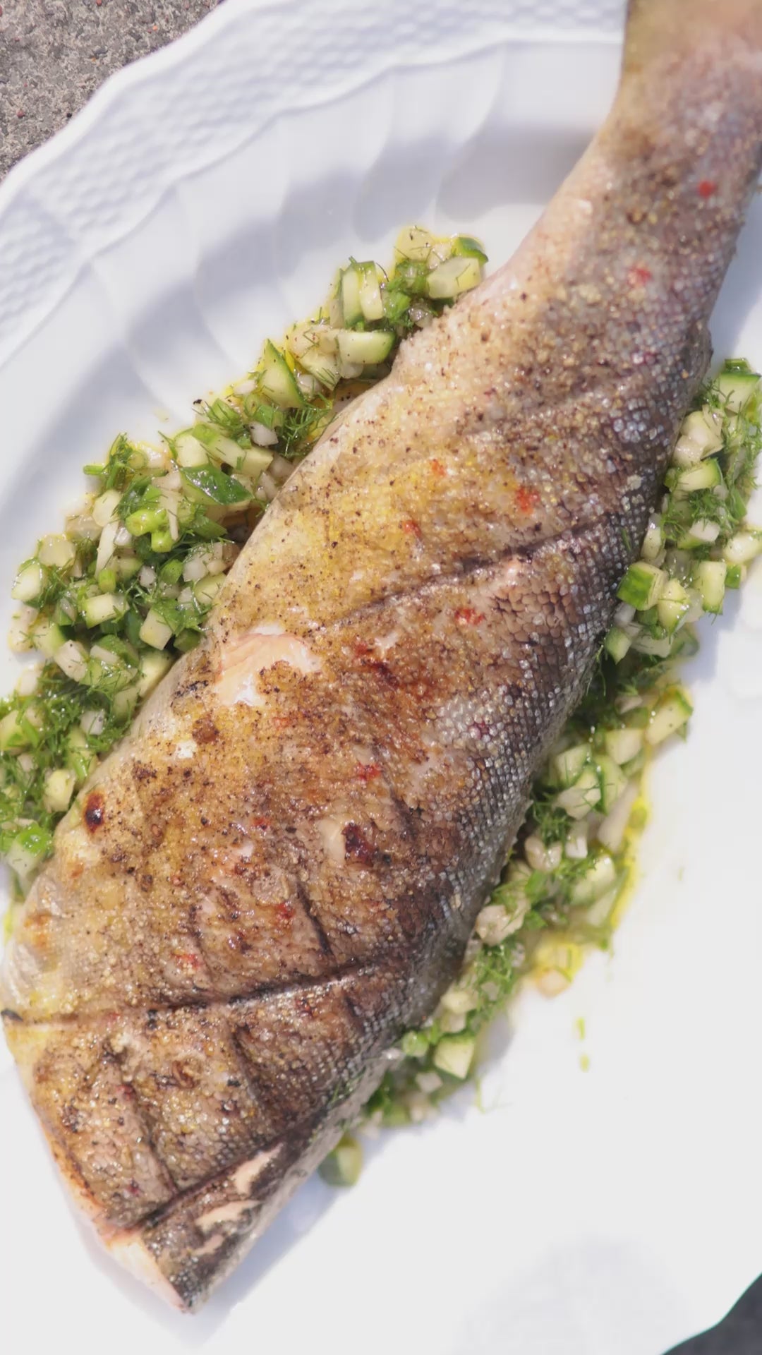 Mark Hix cooks a whole wild trout on the bbq at his house in Lyme Regis